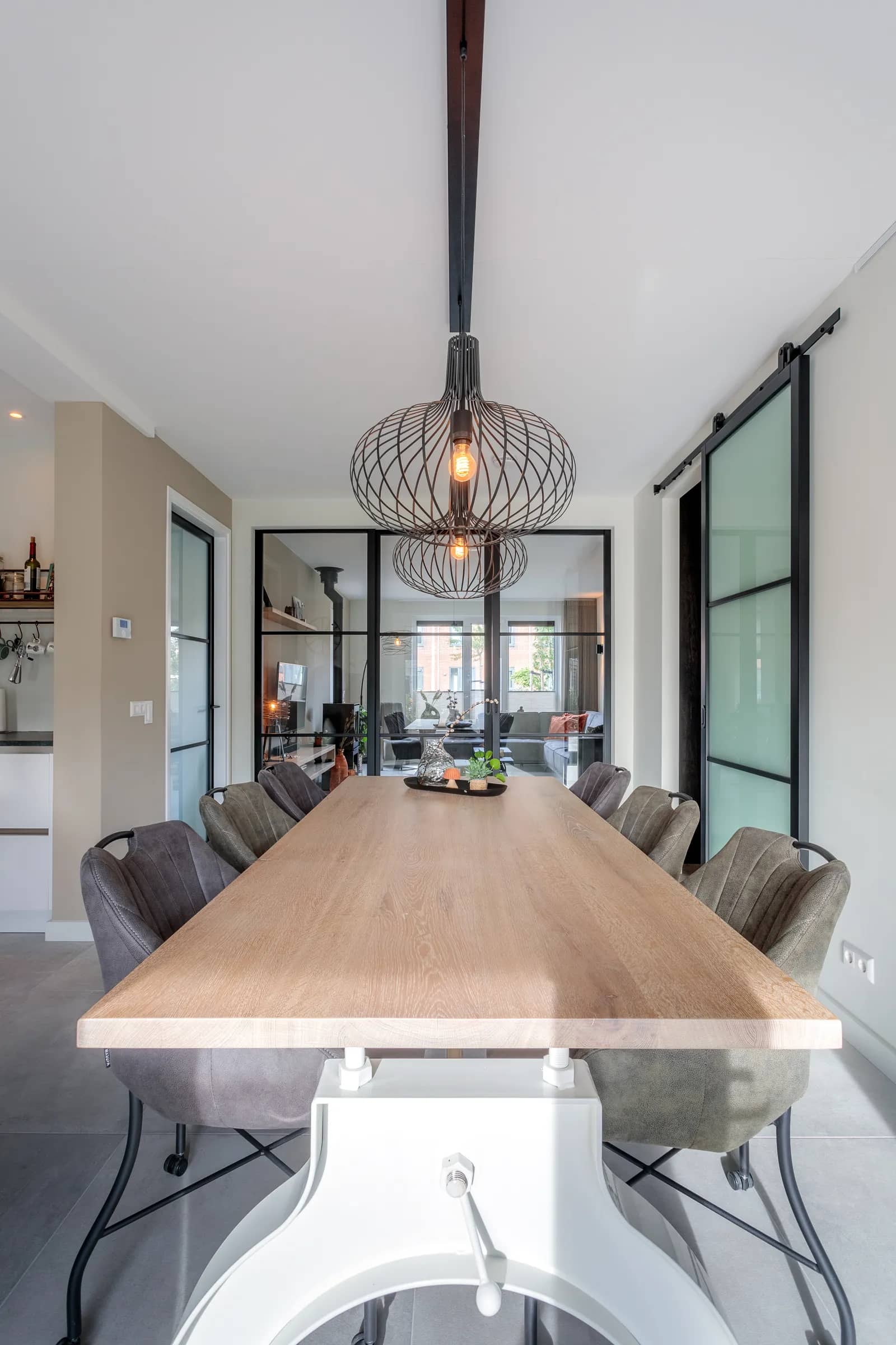 Oak dining table seen up close along its length in the Loosman family home